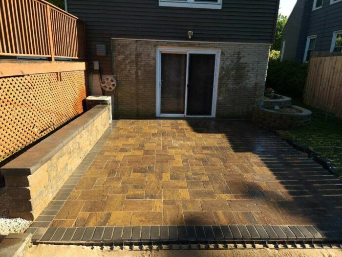 Paver Patio with seating wall after photo of paver patio with seating wall landscaping project