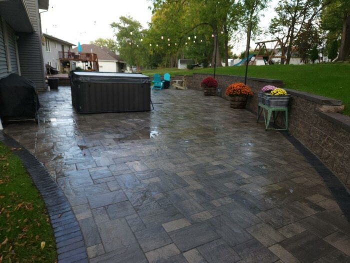Paver Patio with Retaining Wall after photo of paver patio with retaining wall landscaping project