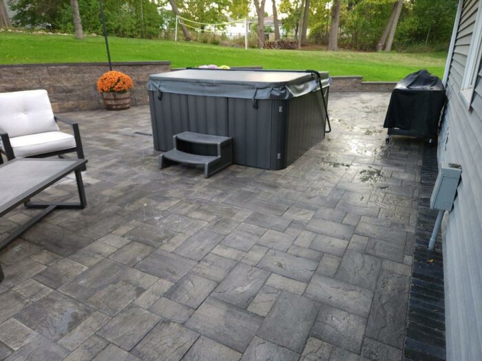 Paver Patio with retaining wall after photo of paver patio with retaining wall landscaping project